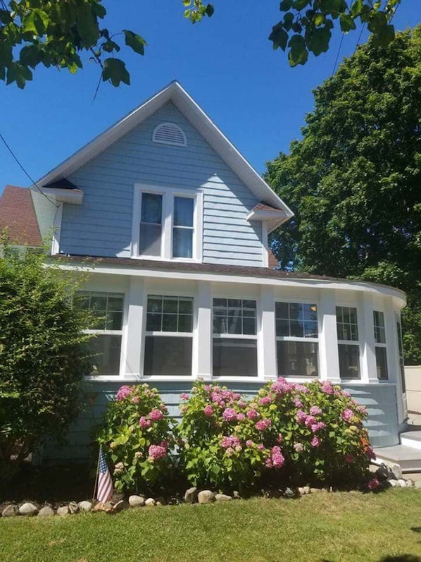 Blue house with  wrap-around porch