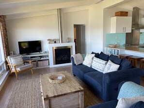 Lounge room with 2 x 3 seater sofas and comfy arm chair