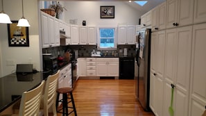 Kitchen with granite counter. Bar seating for 6/8