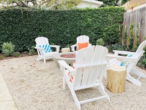 Fire pit shared with other cottages creates a welcoming vibe.