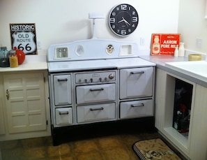 Vintage 1930's stove inspired the apartment's name -used for utensil storage