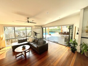 Lounge with bi-fold doors onto deck/pool