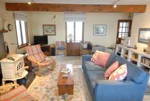 Living room with west view.  Couch showing has been replaced with a new one.