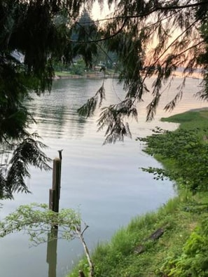 Beginning of sunset at high tide from front deck of cottage.