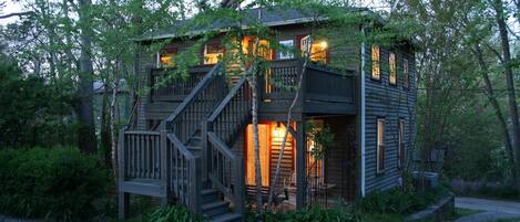 Entry deck above covered porch off lower bedroom, parking left, driveway right