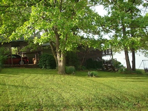 Another  side view of the cabin with freshly mown grass.