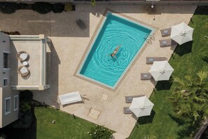 Dive into crystal-clear waters in your private pool.