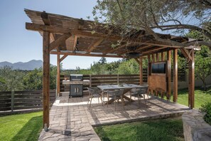 Grill and dine outdoors with a stunning view.