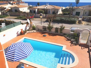 View of the pool and sea view from the veranda