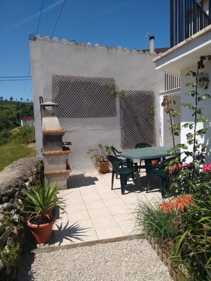 Patio with BBQ and dining furniture