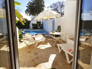 The Master Bedroom has doors to the patio & pool. Imagine waking up to this!