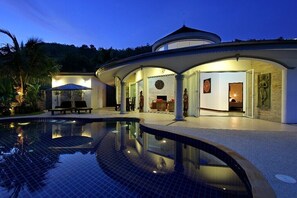 Front view of your villa at sunset