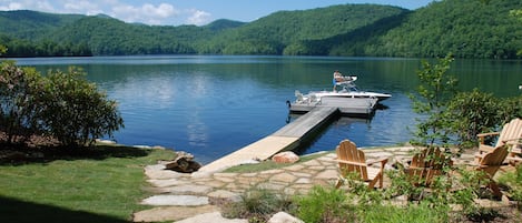 Private dock, patio with fire pit, walkway to lake.