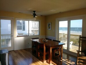 Dining table looking out to ocean through sliding glass doors!