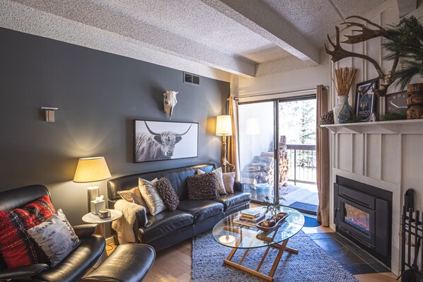 Living room with firewood for wood burning fireplace 