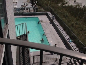 Large swimming pool. View from balcony. First floor,but 2 levels of parking underneath. So you are not subjected to pool noise
