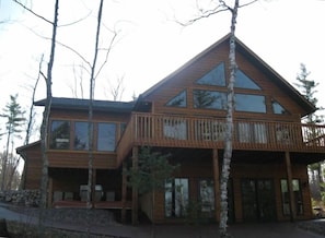 Finshed walkout lower level onto a concrete patio as well as wrap around deck.