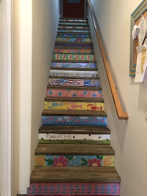 Painted stairs at private entrance.