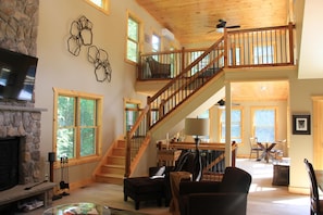 Living room with loft bedroom and king sized bed! Lots of light! 

