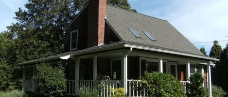 Windward Cottage, view of the property and the large wrap-around porch.