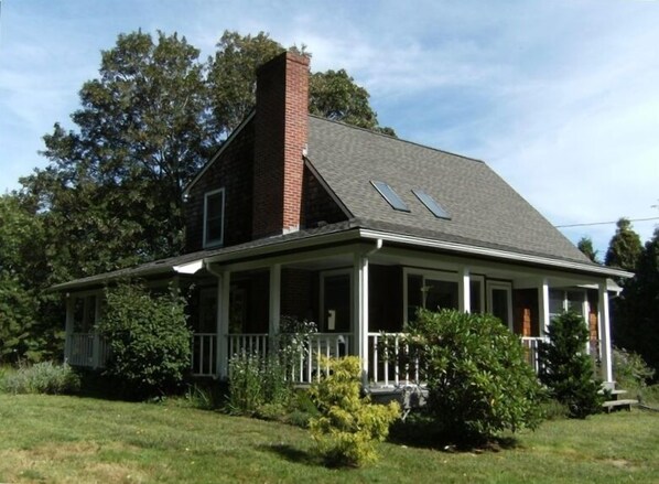 Windward Cottage, view of the property and the large wrap-around porch.