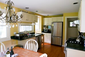 Kitchen and dining area. Table can expand for larger groups.