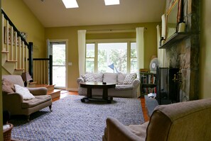 Sitting room: comfortable, bright and airy with skylights and a ceiling fan