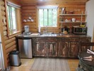 Well-appointed kitchen includes stove, microwave, fridge and Keurig coffee maker