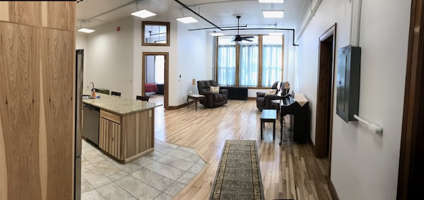 Entry showing living area, kitchen