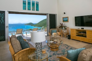 Great Room View of the Pool Deck, Pool, and Bay