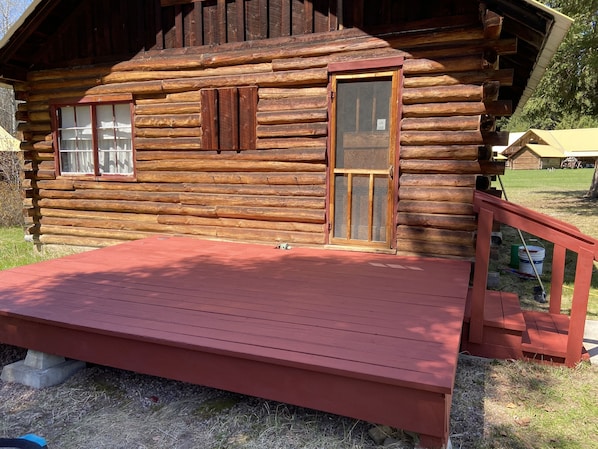 Front of cabin with deck.