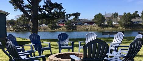 Backyard Fire Ring With Large Yard To The River's Edge