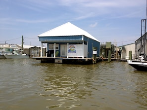 Located on slip B-6.  Walk around decking on all sides of houseboat.  