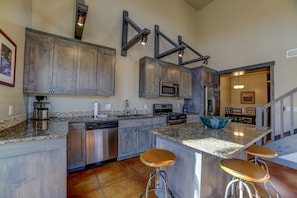 Kitchen with dining room in the background.