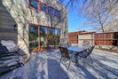 Private patio with propane BBQ. Cottonwood trees along the back fence.