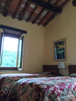 The second bedroom, with two single beds that can be combined.