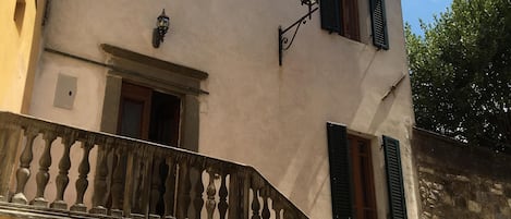 The front door of the house, accessed from within the walls of the old city.