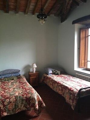 The third bedroom, which has two single beds.