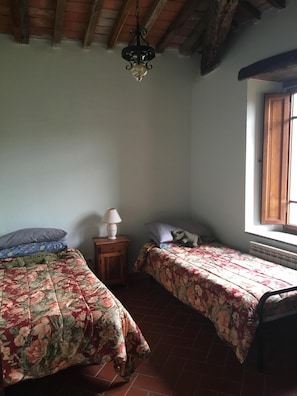 The third bedroom, which has two single beds.