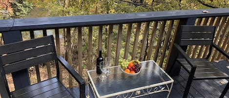 Deck overlooking the river (hard to see since the water blends into the leaves.