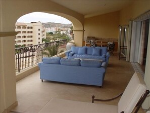Large private shaded balcony overlooking pool and ocean w/ wet bar & gas grill