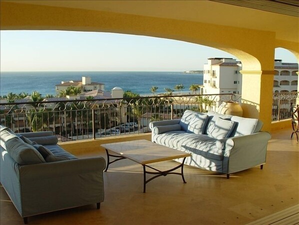 Large private shaded balcony overlooking pool and ocean w/ wet bar & gas grill