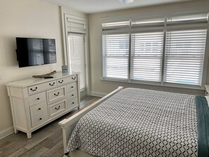 Master Bedroom with TV and access door to patio.