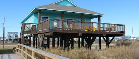 View of the front of the house that sits facing the beach from private walkover