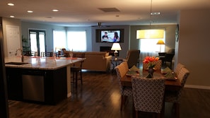 Great room equipped with 60" smart HDTV and Bluetooth Soundbar.  
