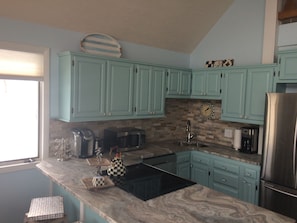 Recently updated kitchen with granite countertops and stainless steel appliances