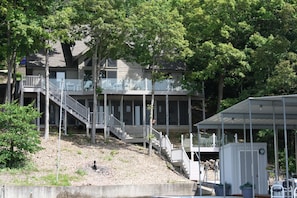 House from the lake with dock locker in the foreground