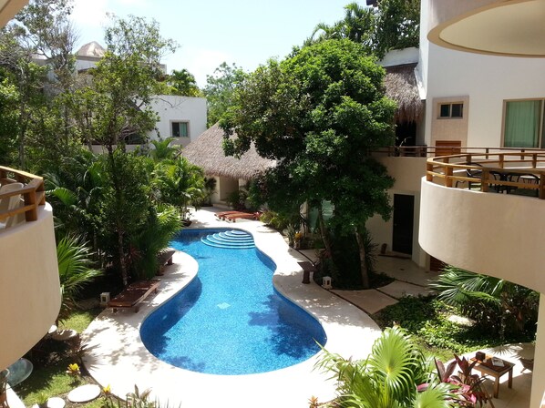 Our balcony on the right with sitting area and pool view below from 2nd floor.