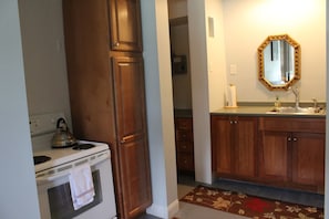 Kitchen area: electric range and sink area