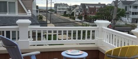 Enjoy the ocean breeze from the wrap-around porch looking towards the ocean.